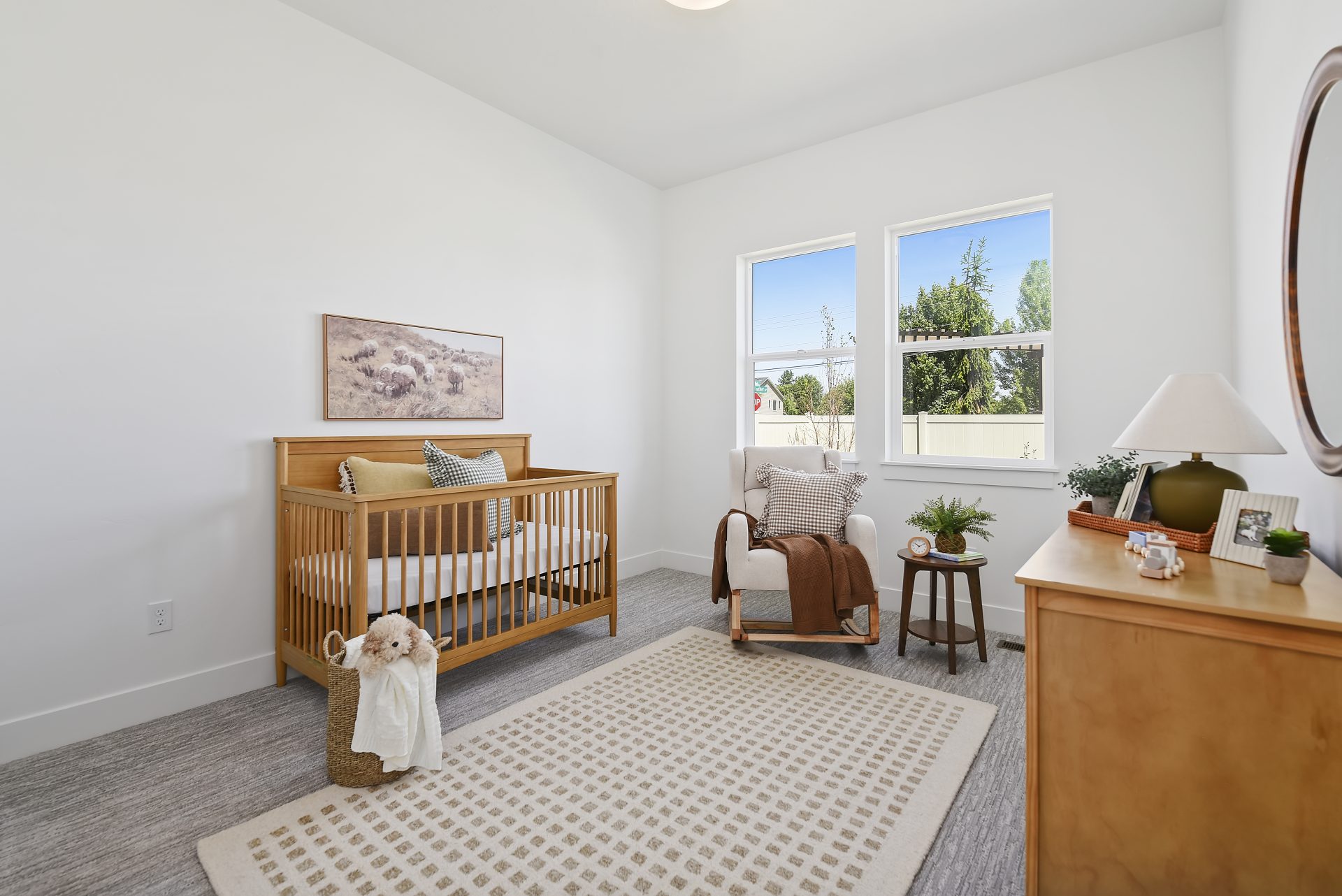 Upstairs carpeted bedroom with two large windows, 9 foot ceilings and canned lighting.