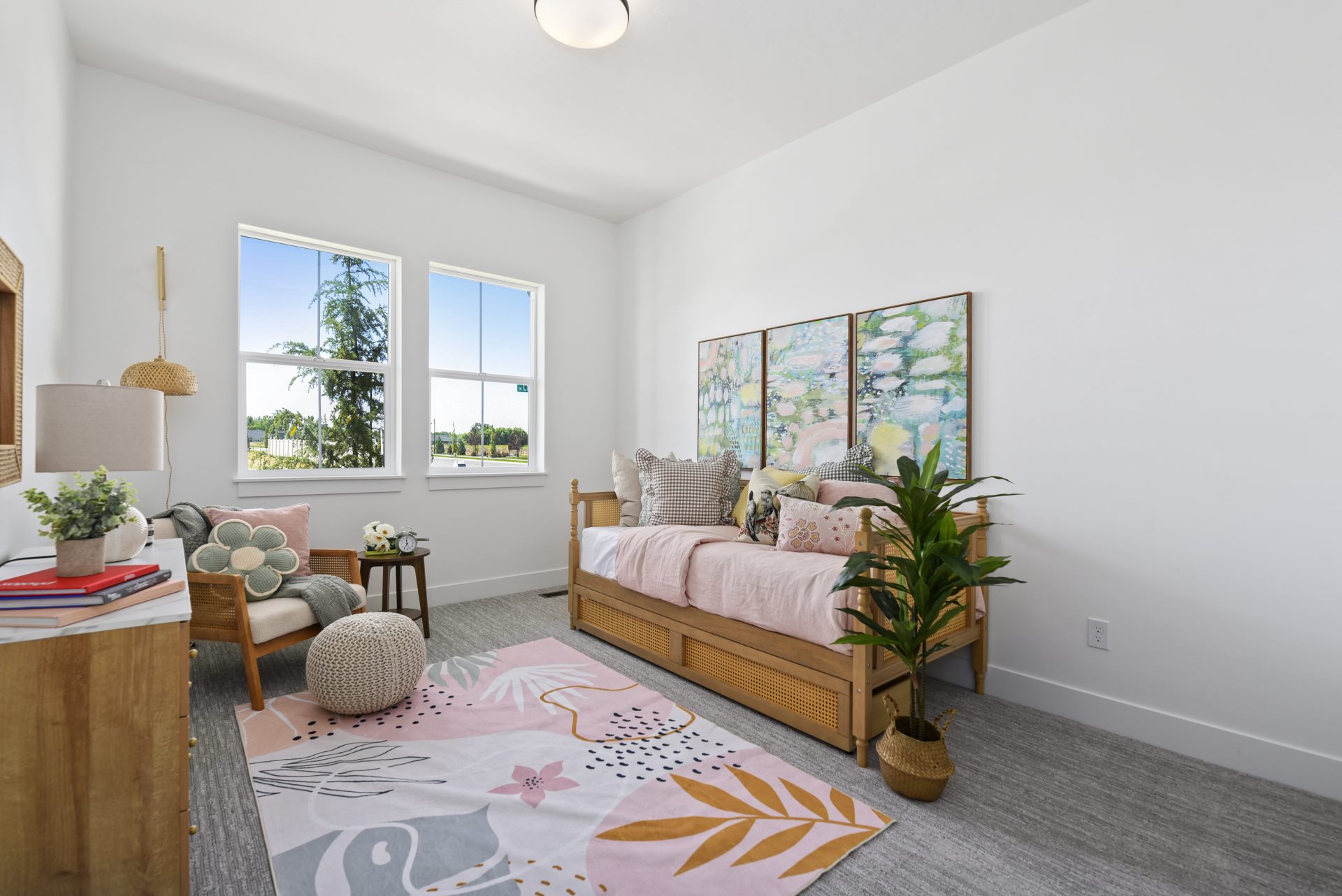 Upstairs carpeted landing that can also be used as an office with two large windows, 9 foot ceilings and flush-mount pendant light.