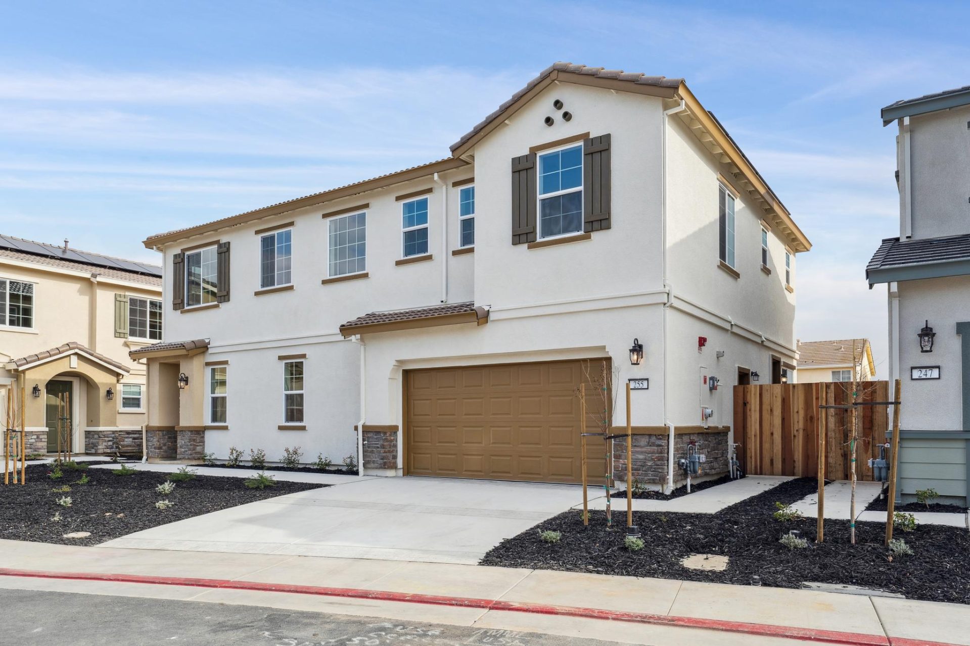 alt text for this image10:19 AMClaude responded: Two-story home with cream stucco exterior, terracotta tile roof, stone veneer wainscoting, and a brown two-car garage.Two-story home with cream stucco exterior, terracotta tile roof, stone veneer wainsc