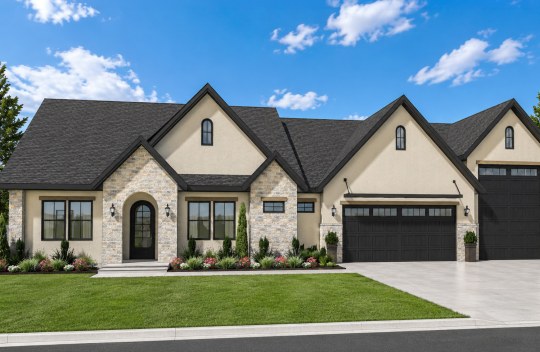 New construction Cherished Estates Harmony Euro elevation is a single-story, single-family home with cream stucco, stone accents, an arched front door, and a 2-car garage with an RV garage.